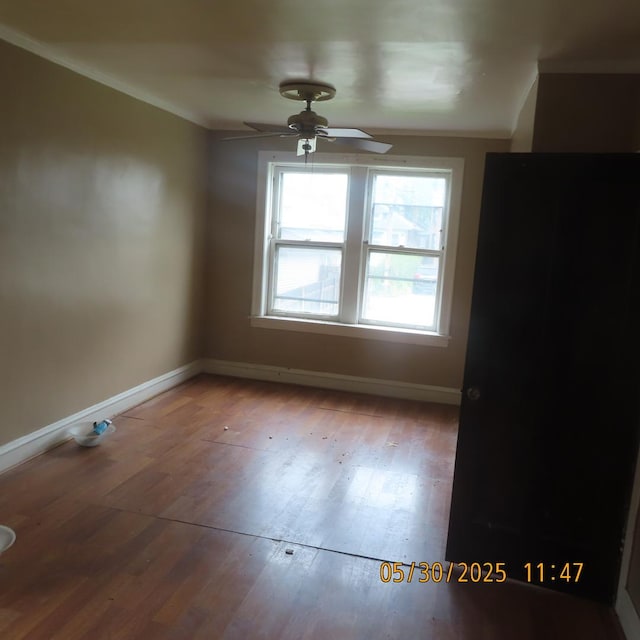 7741 S Indiana Ave, Chicago, IL 60619 - unfurnished dining area featuring a ceiling fan, wood finished floors, and ornamental molding