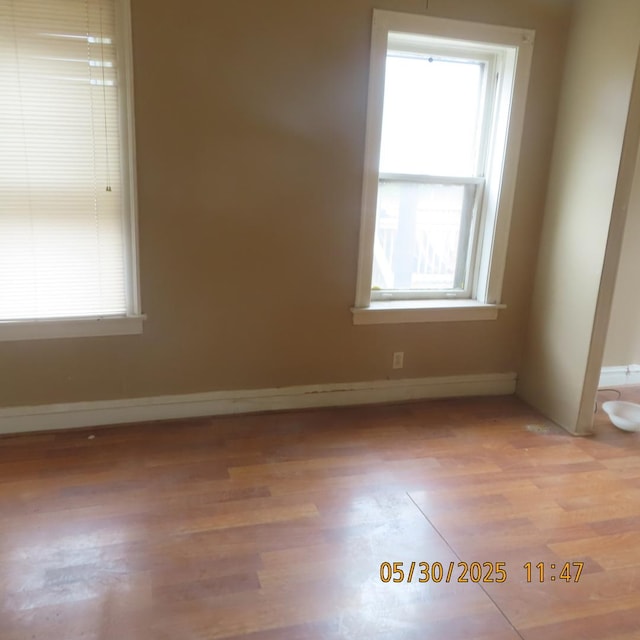 7741 S Indiana Ave, Chicago, IL 60619 - unfurnished room with plenty of natural light and light wood finished floors