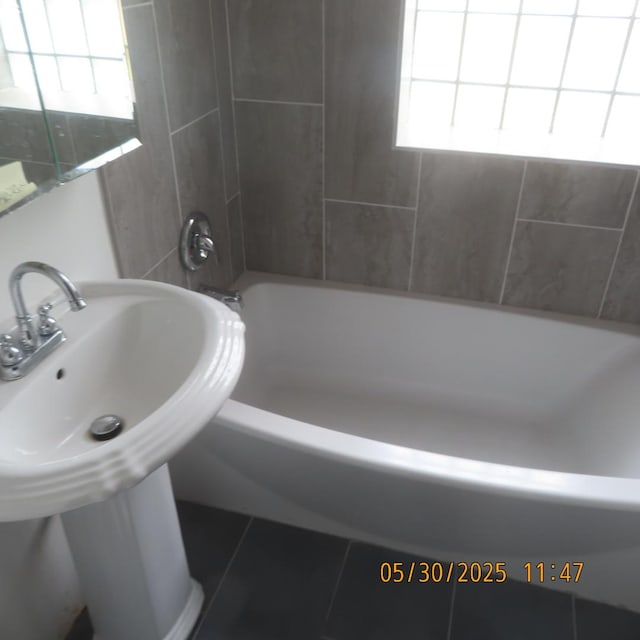 7741 S Indiana Ave, Chicago, IL 60619 - bathroom featuring tile patterned floors and  shower combination