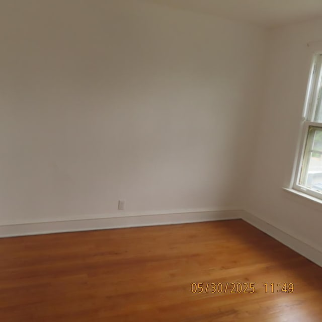 7741 S Indiana Ave, Chicago, IL 60619 - empty room featuring light wood-type flooring and baseboards