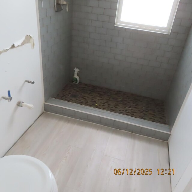 7741 S Indiana Ave, Chicago, IL 60619 - full bath with a stall shower and wood finished floors