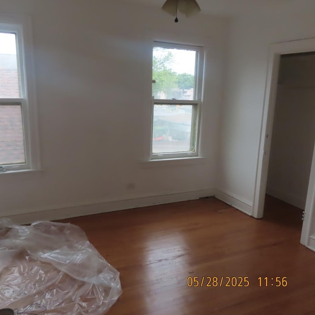 7741 S Indiana Ave, Chicago, IL 60619 - unfurnished bedroom with wood finished floors