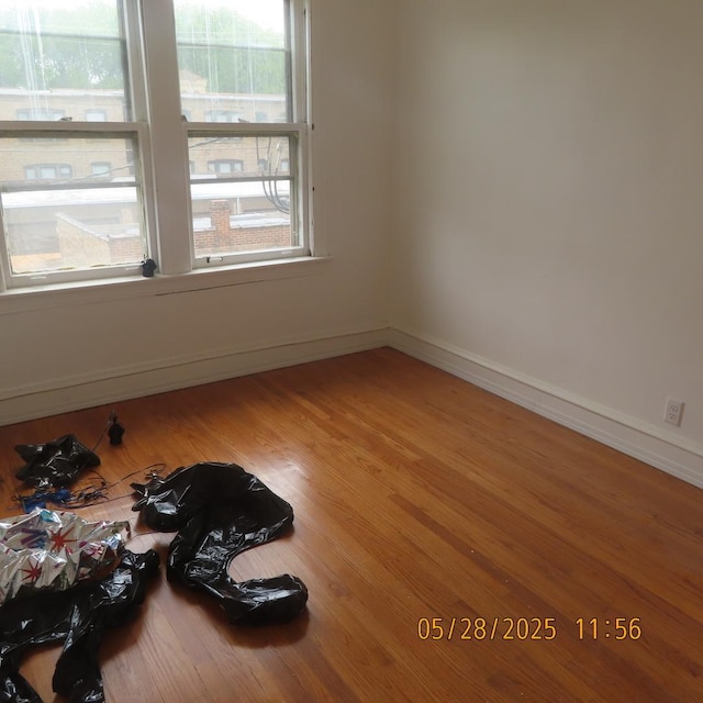 7741 S Indiana Ave, Chicago, IL 60619 - empty room with wood finished floors and baseboards