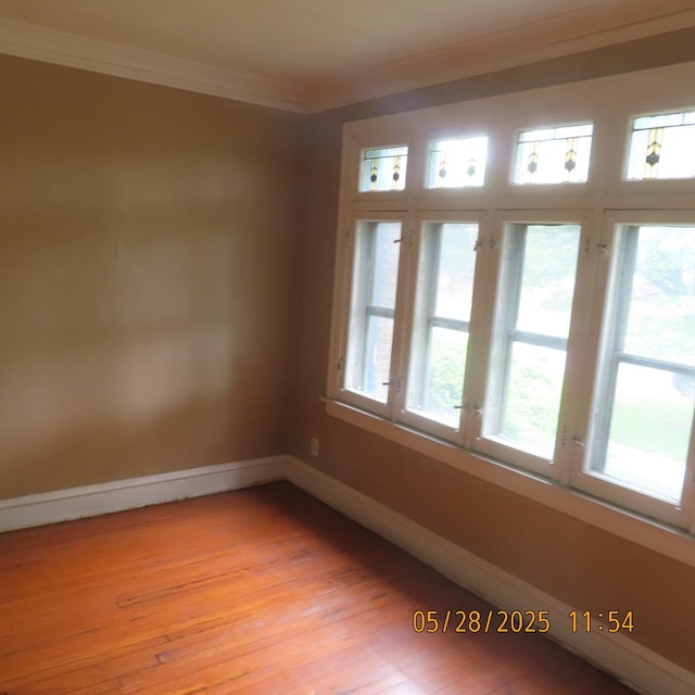 7741 S Indiana Ave, Chicago, IL 60619 - empty room featuring crown molding and light wood-style flooring