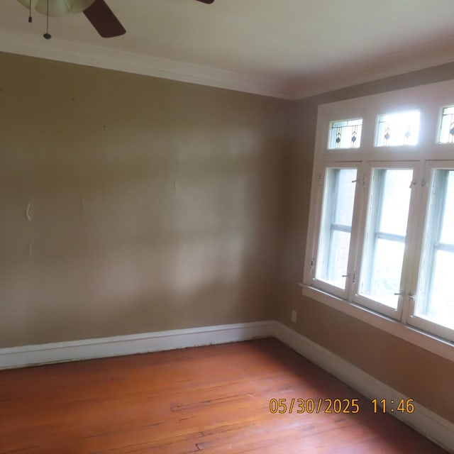 7741 S Indiana Ave, Chicago, IL 60619 - spare room with ceiling fan, ornamental molding, and wood finished floors