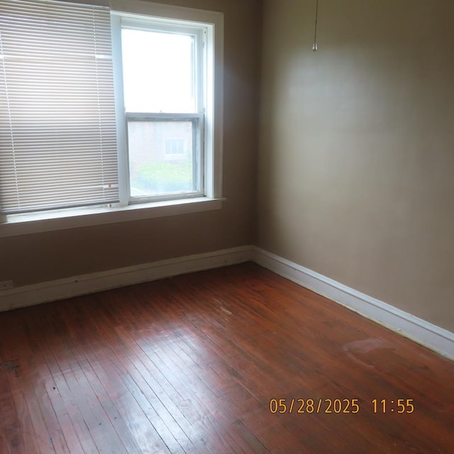 7741 S Indiana Ave, Chicago, IL 60619 - spare room with plenty of natural light and dark wood-style flooring