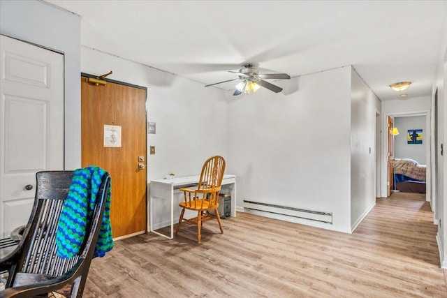 413 Berkshire Dr Unit 22, Crystal Lake, IL 60014 - living area with a baseboard radiator, a ceiling fan, wood finished floors, and an office area