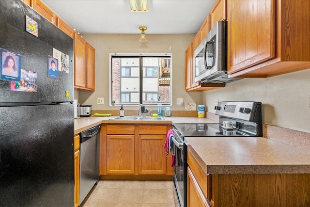 413 Berkshire Dr Unit 22, Crystal Lake, IL 60014 - kitchen with appliances with stainless steel finishes, light countertops, and brown cabinetry