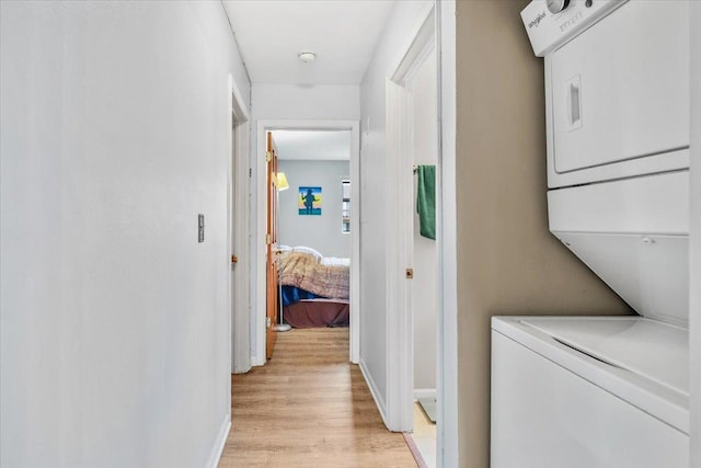 413 Berkshire Dr Unit 22, Crystal Lake, IL 60014 - laundry area featuring stacked washer / dryer and light wood finished floors