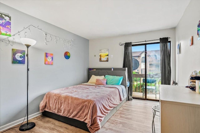 413 Berkshire Dr Unit 22, Crystal Lake, IL 60014 - bedroom with light wood-style flooring and access to exterior