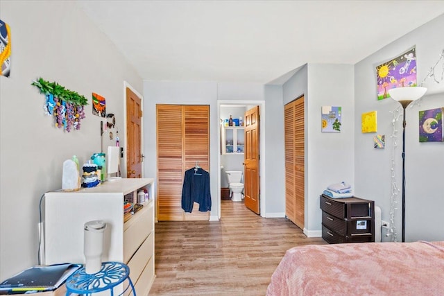 413 Berkshire Dr Unit 22, Crystal Lake, IL 60014 - bedroom featuring light wood-type flooring and ensuite bath