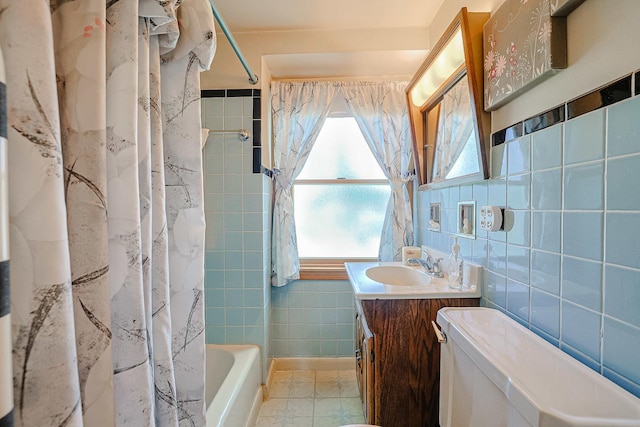 3750 N Octavia Ave, Chicago, IL 60634 - full bathroom with tile walls, vanity, healthy amount of natural light, and shower / bath combo with shower curtain