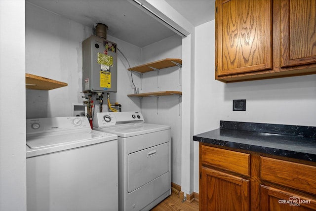 812 S Sumner Ave, Aurora, IL 60505 - laundry room with washing machine and clothes dryer, cabinet space, water heater, and light wood finished floors