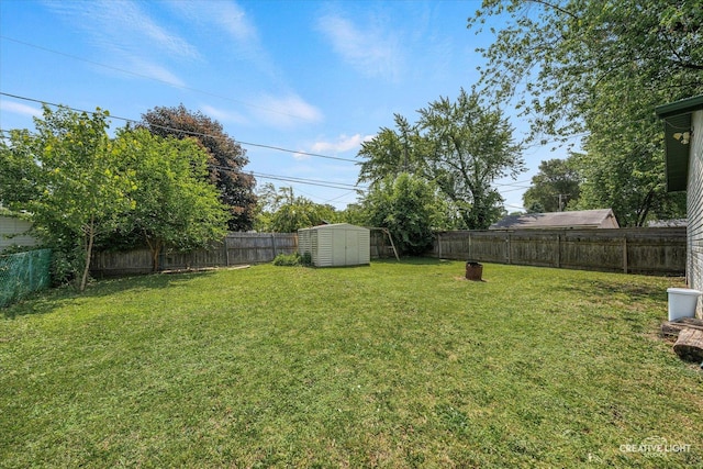 812 S Sumner Ave, Aurora, IL 60505 - fenced backyard featuring a storage unit