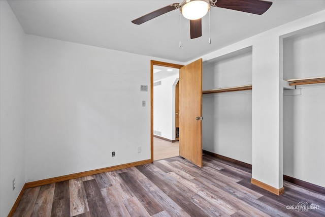 812 S Sumner Ave, Aurora, IL 60505 - unfurnished bedroom with wood finished floors and a ceiling fan