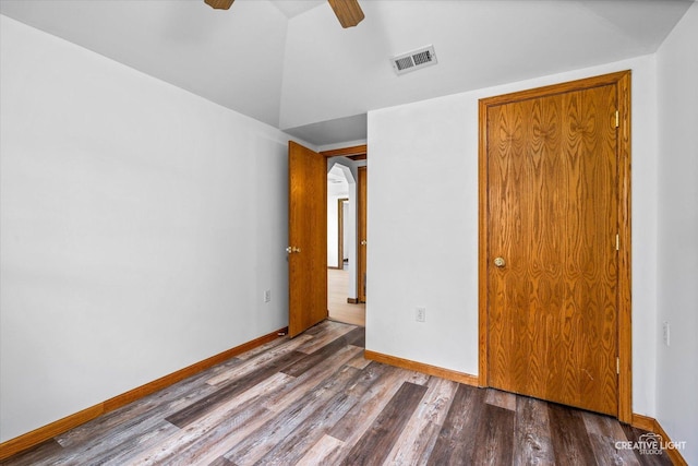 812 S Sumner Ave, Aurora, IL 60505 - unfurnished bedroom featuring wood finished floors, a ceiling fan, and lofted ceiling