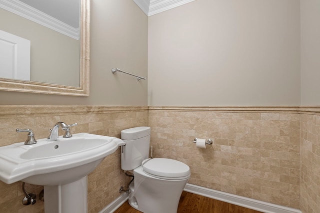 1000 Village Center Dr Unit 103, Burr Ridge, IL 60527 - bathroom with tile walls, ornamental molding, a wainscoted wall, and wood finished floors