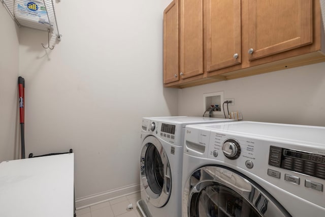 1000 Village Center Dr Unit 103, Burr Ridge, IL 60527 - laundry room featuring cabinet space, washer and dryer, and light tile patterned floors