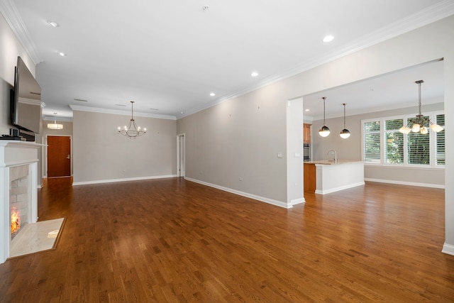 1000 Village Center Dr Unit 103, Burr Ridge, IL 60527 - unfurnished living room with a chandelier, a fireplace with flush hearth, dark wood-type flooring, recessed lighting, and crown molding