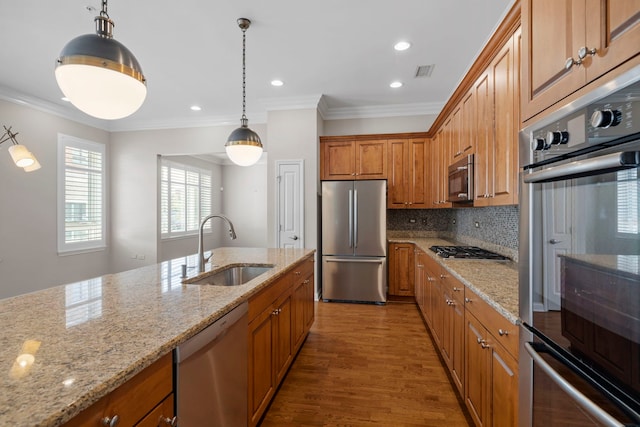 1000 Village Center Dr Unit 103, Burr Ridge, IL 60527 - kitchen with stainless steel appliances, brown cabinetry, wood finished floors, light stone counters, and decorative backsplash