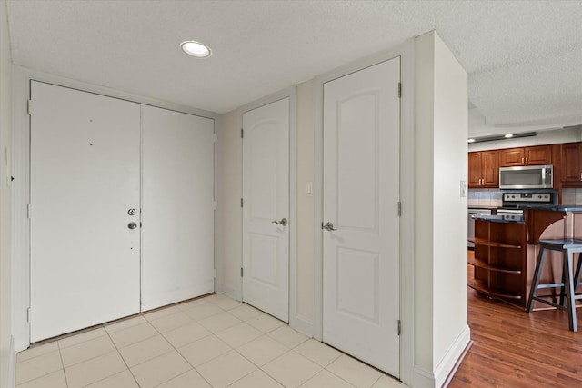 920 Vose Dr Unit 612, Gurnee, IL 60031 - entrance foyer featuring a textured ceiling, recessed lighting, and light wood finished floors