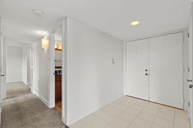 920 Vose Dr Unit 612, Gurnee, IL 60031 - entrance foyer featuring a textured ceiling and recessed lighting