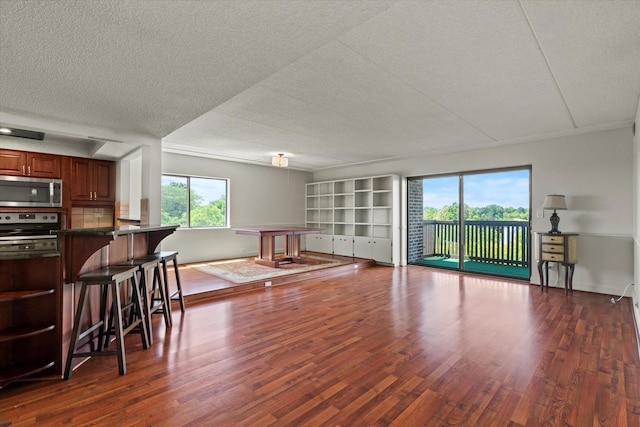 920 Vose Dr Unit 612, Gurnee, IL 60031 - living area featuring dark wood-type flooring and a textured ceiling