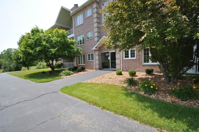 11535 Settlers Pond Way Unit 1C, Orland Park, IL 60467 - view of front of home with brick siding and a front yard