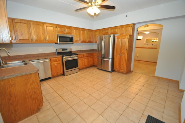 11535 Settlers Pond Way Unit 1C, Orland Park, IL 60467 - kitchen featuring stainless steel appliances, ceiling fan, brown cabinets, and arched walkways