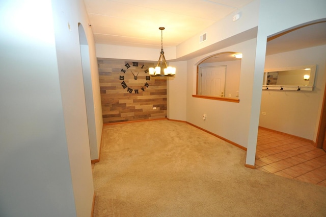 11535 Settlers Pond Way Unit 1C, Orland Park, IL 60467 - empty room with carpet, arched walkways, and a chandelier
