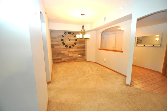11535 Settlers Pond Way Unit 1C, Orland Park, IL 60467 - tiled spare room with carpet, a chandelier, and arched walkways