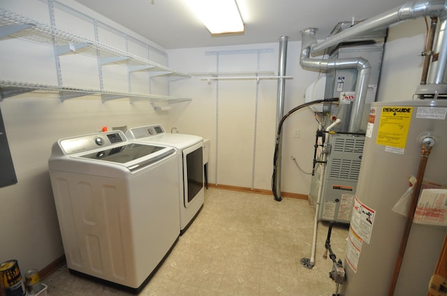 11535 Settlers Pond Way Unit 1C, Orland Park, IL 60467 - laundry room featuring washing machine and clothes dryer, gas water heater, and light floors