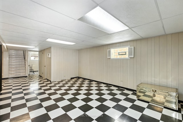 3219 N Pioneer Ave, Chicago, IL 60634 - below grade area featuring tile patterned floors, a drop ceiling, plenty of natural light, and stairs