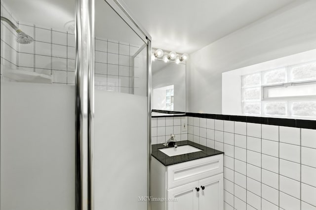 3219 N Pioneer Ave, Chicago, IL 60634 - bathroom with a stall shower, vanity, and tile walls