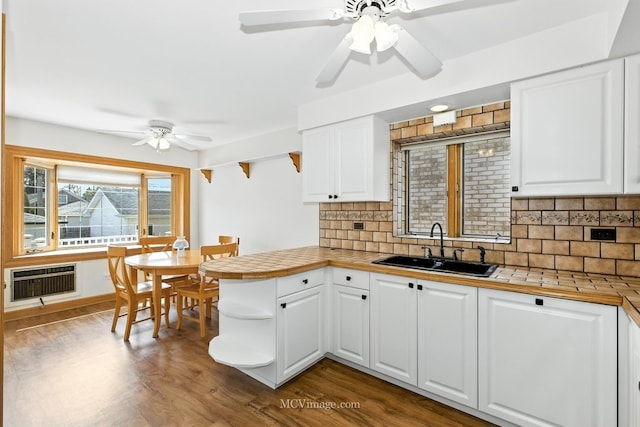 3219 N Pioneer Ave, Chicago, IL 60634 - kitchen with a ceiling fan, a peninsula, white cabinets, and open shelves