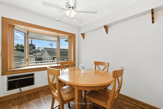 3219 N Pioneer Ave, Chicago, IL 60634 - dining room featuring wood finished floors, heating unit, and ceiling fan