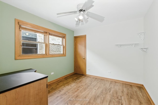 3219 N Pioneer Ave, Chicago, IL 60634 - unfurnished room with light wood-type flooring and a ceiling fan