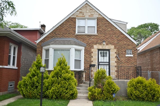 8434 S Yates Blvd, Chicago, IL 60617 - view of front of home with brick siding and a chimney