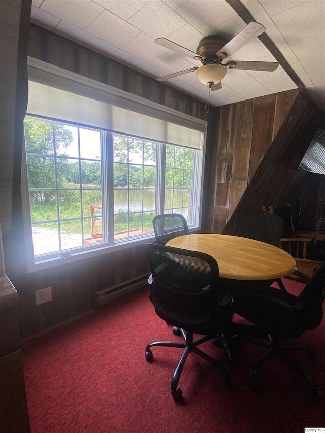 110 E County Rd 150, Warsaw, IL 62379 - office area with a baseboard heating unit, carpet, wood walls, and a ceiling fan