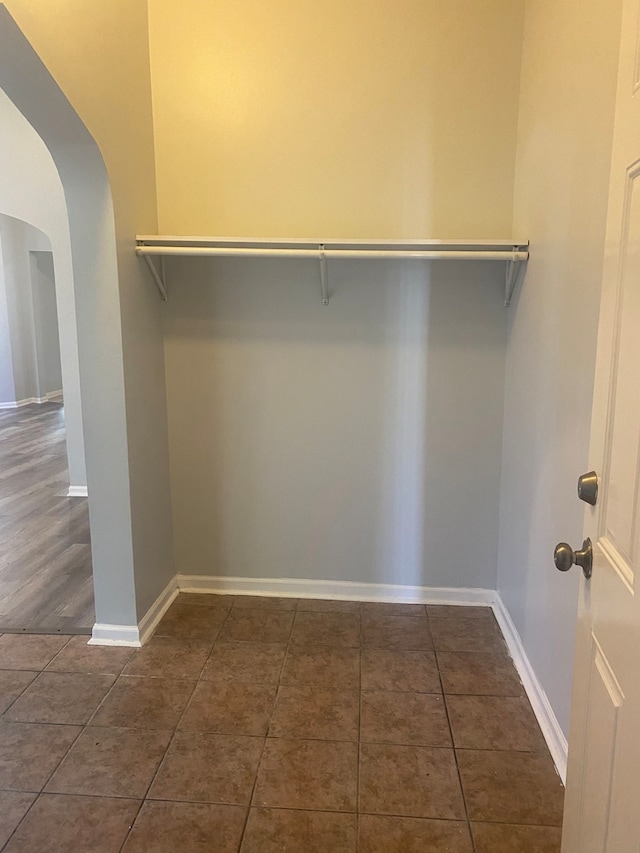 537 W 61st Pl, Chicago, IL 60621 - spacious closet featuring arched walkways and dark tile patterned flooring