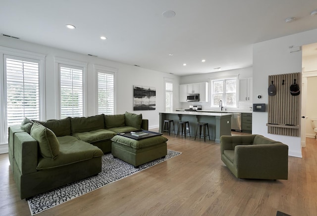 1501 W Diversey Pkwy Unit B, Chicago, IL 60614 - living room featuring wood finished floors and recessed lighting