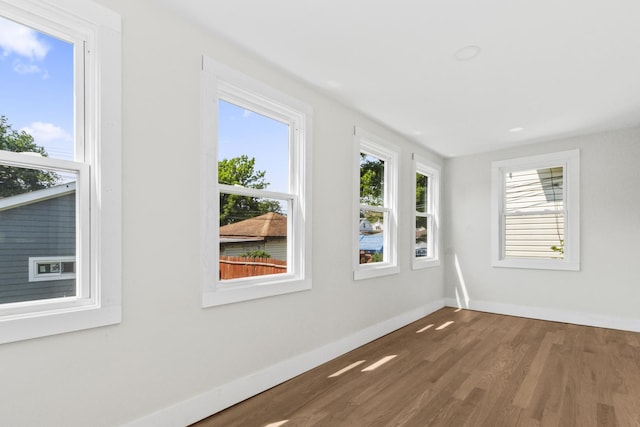 6155 W Cornelia Ave, Chicago, IL 60634 - empty room with wood finished floors and baseboards
