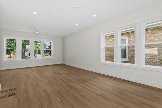 6155 W Cornelia Ave, Chicago, IL 60634 - unfurnished room featuring wood finished floors, ceiling fan, and recessed lighting