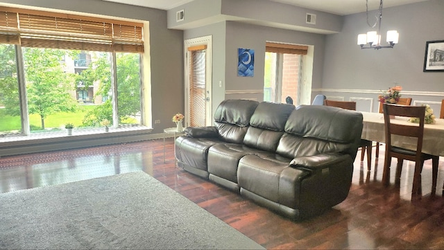 875 E 22nd St Unit 204, Lombard, IL 60148 - living area featuring a chandelier, dark wood-style flooring, and plenty of natural light