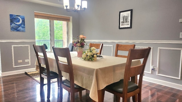 875 E 22nd St Unit 204, Lombard, IL 60148 - dining area with a chandelier, dark wood finished floors, a wainscoted wall, and a decorative wall
