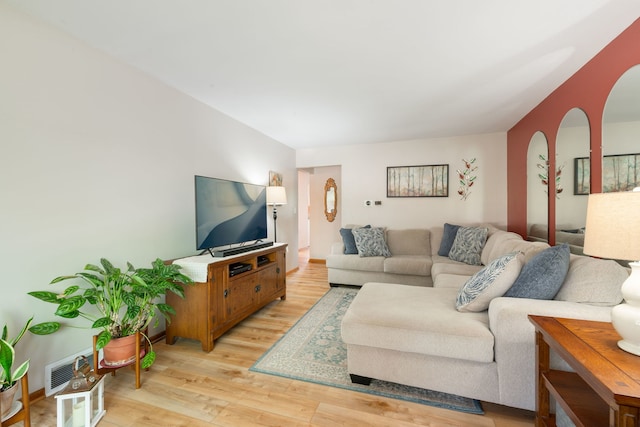 14437 Kostner Ave, Midlothian, IL 60445 - living area featuring light wood-type flooring and arched walkways
