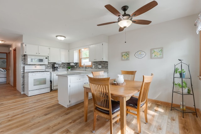 14437 Kostner Ave, Midlothian, IL 60445 - dining area featuring light wood finished floors and a ceiling fan