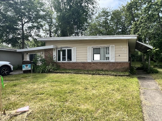 327 Somonauk St, Park Forest, IL 60466 - view of front of property featuring brick siding and a front yard