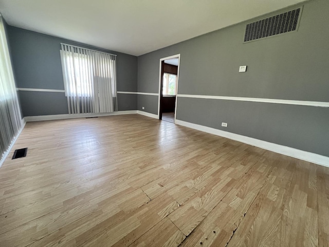 327 Somonauk St, Park Forest, IL 60466 - unfurnished room with light wood-style flooring and baseboards