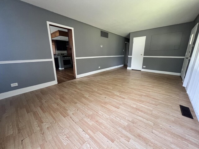 327 Somonauk St, Park Forest, IL 60466 - unfurnished room with light wood-style flooring and baseboards